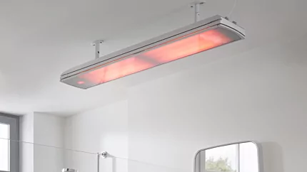 Heatscope Vision 3200W Radiant Heater elegantly wall-mounted in a contemporary indoor bathroom enhances comfort and energy efficiency for residential living.